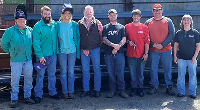 David Gilmer’s, in the middle wearing the vest, welding class had a 100% pass rate for all his students to get their welding certifications.