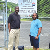 Trazel Silvers and acting Mayor Jelane Mock stand before the basketball court where they often played together as youngsters. The court, called ‘The Jungle,’ is dedicated to the Harlem Globetrotter.  LISA MAINE PHOTO