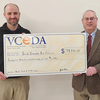 Breaks Interstate Park Superintendent Austin Bradley, left, receives a nearly $80,000 grant check from Virginia Coalfield Economic Development Authority Executive Director Jonathan Belcher for park improvements. Specifically, the money will go toward repainting, repairs and improvements to the park’s existing potable water tank. Any funds remaining after the water tank improvements are made may also be used toward Phase II improvements to the Chafin Lodge, including fire suppression upgrades, the purchase of additional furniture, new flooring and/or for expansion of the gift shop.   VCEDA PHOTO