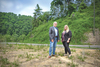 Haysi mayor and county Industrial Development Authority Chair Larry Yates and county economic development Director Dana Cronkhite stand on the former Haysi High School site.  PROVIDED BY COUNTY