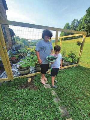 Rhett and Ryden Baker with some of their produce.