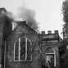 This May 20, 1958,  photo of the Clintwood Methodist Church  shows the front view of the church as it was burning. The photo was found in the October 7, 2009, issue of The Dickenson Star newspaper and in the October 11, 1959,  church  program for the official opening of the church after the fire.