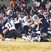 Brady Fleming takes down the Falcon ball carrier. PHOTO BY CRYSTAL COUNTS
