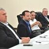 Del. Will Morefield, second from left, discusses talks with West Virginia officials about the Coalfields Expressway. Listening, left to right, are Sen. Travis Hackworth, expressway authority Chair Jay Rife and authority Executive Director Jonathan Belcher.  SUBMITTED PHOTO