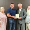 Dickenson County supervisors present a plaque of appreciation to Bud Phillips May 18. Left to right are Rhonda Sluss, Shelbie Willis, Josh Evans, Phillips, Ron Peters and Peggy Kiser.  SUBMITTED PHOTO