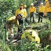 Academy firefighters learn how to draft water from natural sources using portable pumps to fight wildfires.  DEPARTMENT OF FORESTRY PHOTO